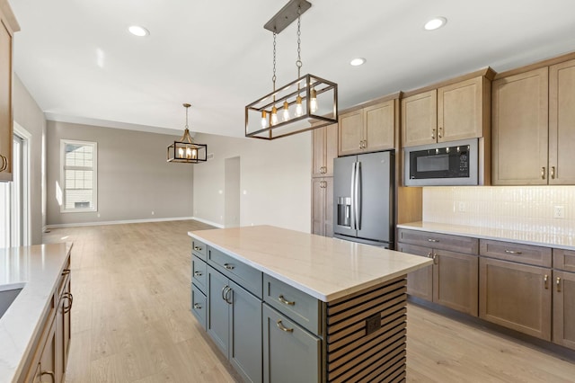 kitchen with stainless steel fridge with ice dispenser, black microwave, tasteful backsplash, a chandelier, and light wood finished floors