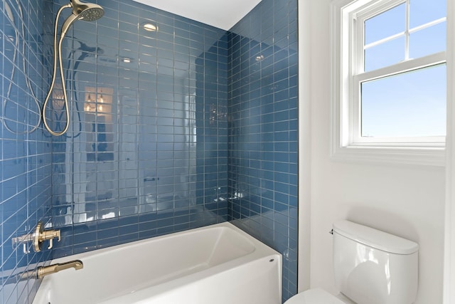 bathroom with toilet and washtub / shower combination