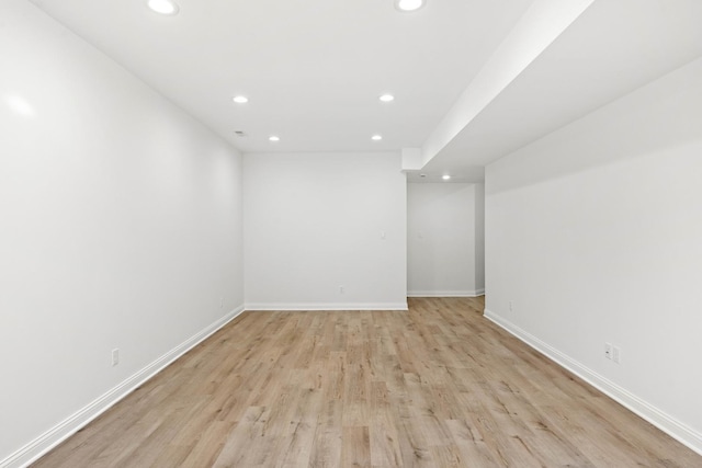 finished basement with recessed lighting, light wood finished floors, and baseboards