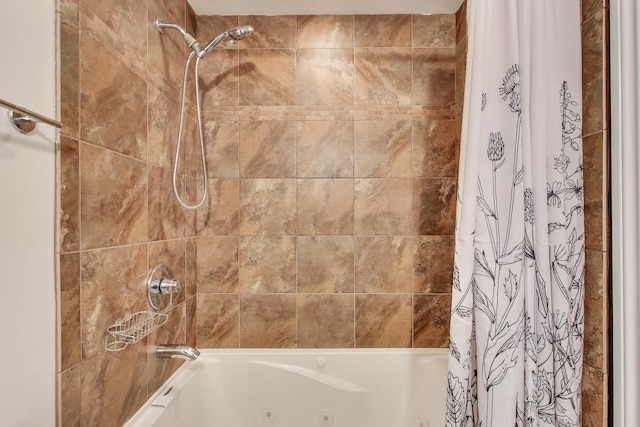 bathroom with a combined bath / shower with jetted tub