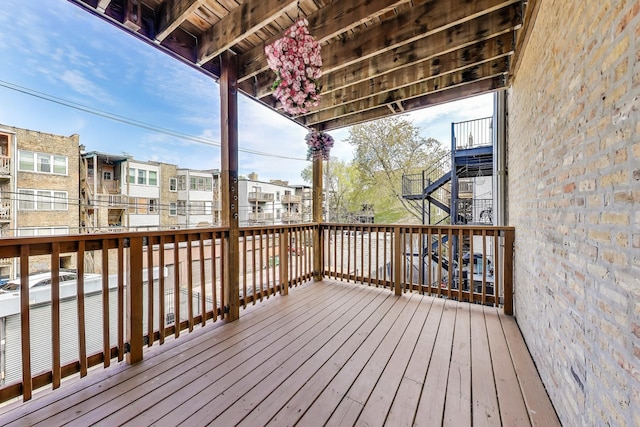 wooden terrace with a residential view