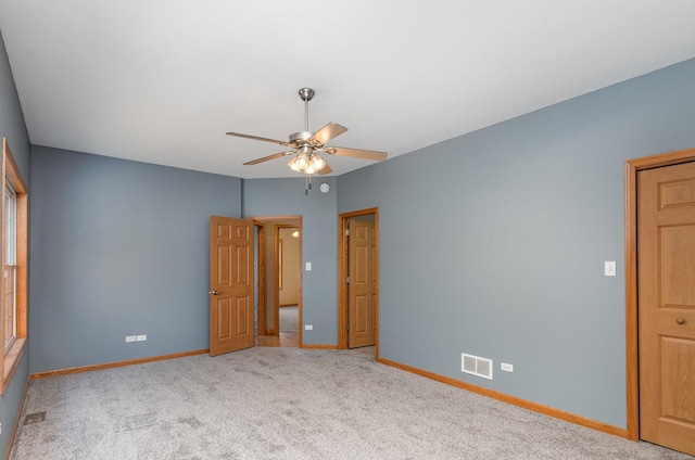 1073 Hawthorne Ave, Beecher, IL 60401 - unfurnished bedroom with baseboards, carpet flooring, and ceiling fan