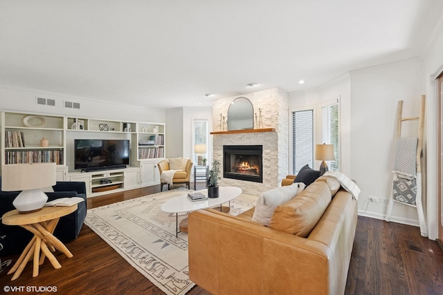 2116 Nachtman Ct, Wheaton, IL 60187 - living room featuring a fireplace, dark wood finished floors, ornamental molding, and built in features