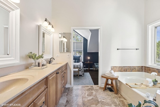 2116 Nachtman Ct, Wheaton, IL 60187 - bathroom featuring healthy amount of natural light, a bath, double vanity, a high ceiling, and ensuite bathroom