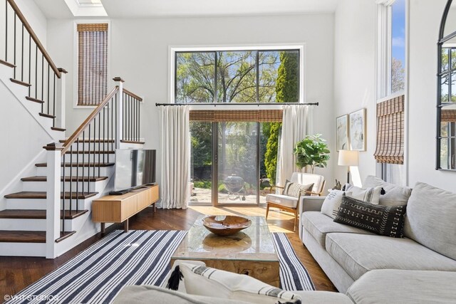 2116 Nachtman Ct, Wheaton, IL 60187 - living area featuring wood finished floors, a towering ceiling, and stairs