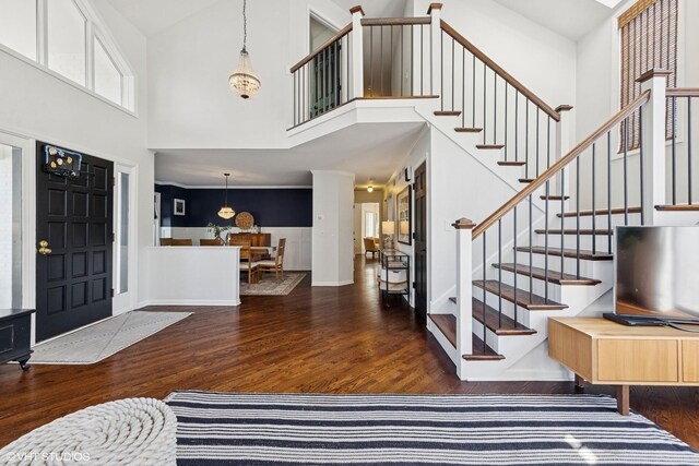 2116 Nachtman Ct, Wheaton, IL 60187 - foyer entrance with wood finished floors, a high ceiling, stairs, and wainscoting