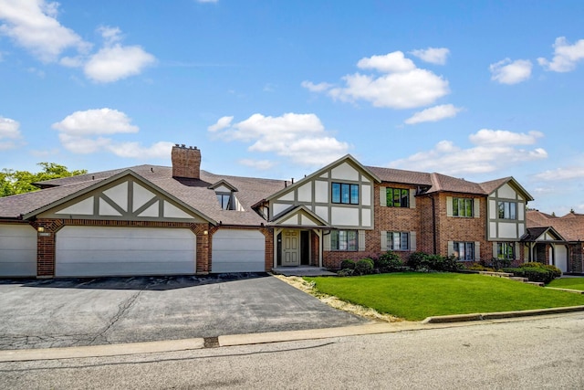 13228 S Westview Dr Unit 2A, Palos Heights, IL 60463 - english style home featuring brick siding, asphalt driveway, an attached garage, and a front lawn