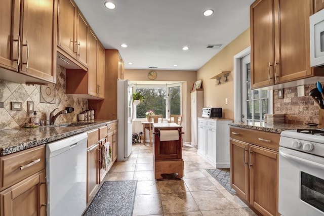 13228 S Westview Dr Unit 2A, Palos Heights, IL 60463 - kitchen with white appliances, a sink, recessed lighting, tasteful backsplash, and brown cabinetry