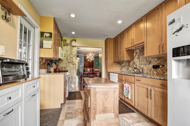 13228 S Westview Dr Unit 2A, Palos Heights, IL 60463 - kitchen with white appliances, tasteful backsplash, a sink, recessed lighting, and light stone finish floors