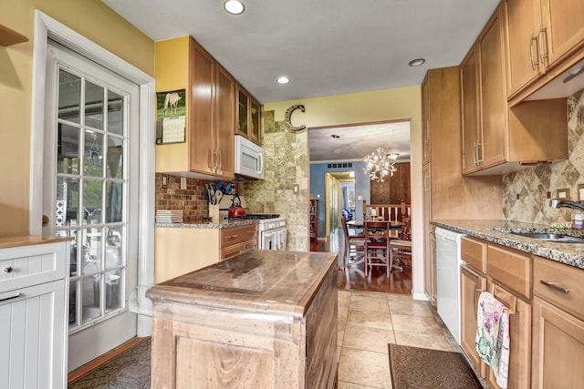 13228 S Westview Dr Unit 2A, Palos Heights, IL 60463 - kitchen with white appliances, a sink, backsplash, recessed lighting, and a chandelier