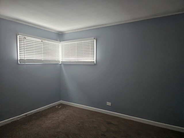 216 Washington St, Park Forest, IL 60466 - empty room featuring baseboards, dark colored carpet, and crown molding