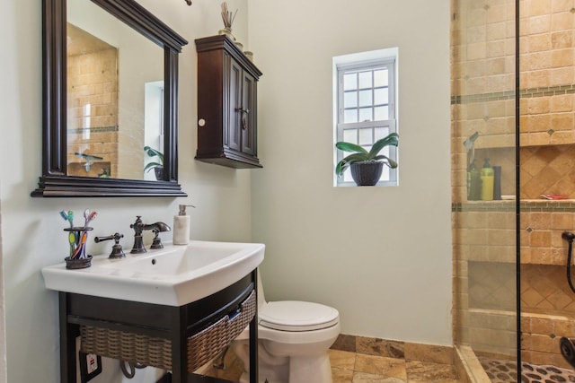 89 Huron St, Maywood, IL 60153 - full bath featuring a stall shower, toilet, vanity, baseboards, and stone finish flooring
