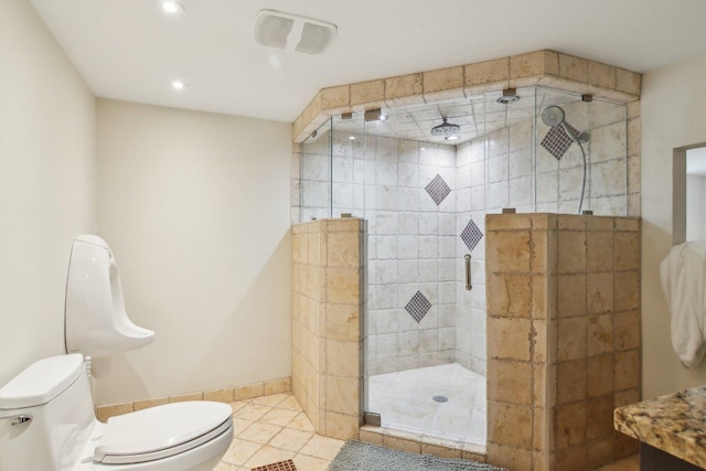 89 Huron St, Maywood, IL 60153 - bathroom featuring toilet, recessed lighting, a stall shower, tile patterned floors, and baseboards