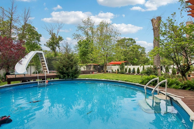 89 Huron St, Maywood, IL 60153 - outdoor pool featuring a water slide and a yard