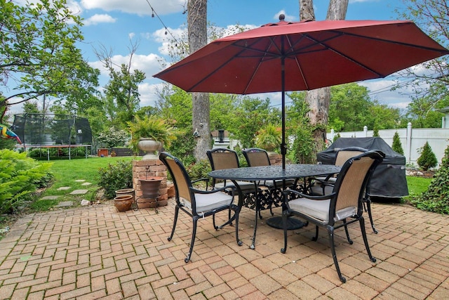 89 Huron St, Maywood, IL 60153 - view of patio / terrace featuring a trampoline, outdoor dining area, and a grill