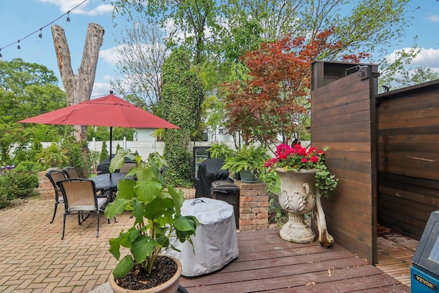 89 Huron St, Maywood, IL 60153 - deck featuring outdoor dining area, a fenced backyard, and a patio area