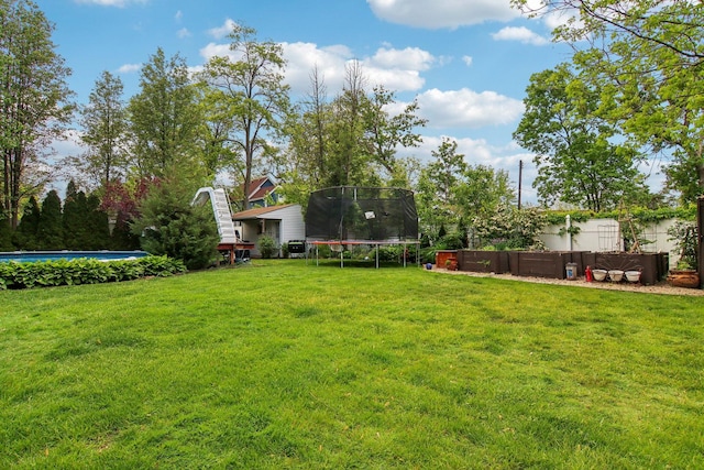 89 Huron St, Maywood, IL 60153 - view of yard featuring a trampoline and an outdoor pool