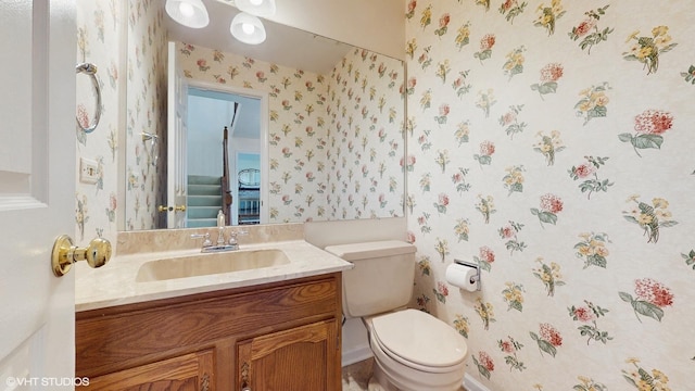 315 Carmelhead Ln, Schaumburg, IL 60193 - half bath featuring wallpapered walls, vanity, toilet, and baseboards