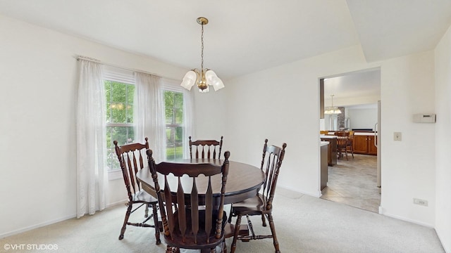 315 Carmelhead Ln, Schaumburg, IL 60193 - dining room with a chandelier, light colored carpet, and baseboards