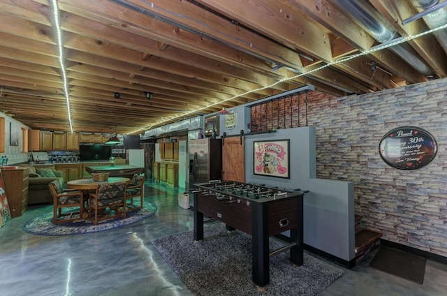 32911 Deer Ridge Dr, Wilmington, IL 60481 - rec room with finished concrete flooring and a barn door
