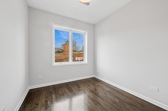 1018 N Honore Ave Unit C, Chicago, IL 60622 - empty room with dark wood-style floors and baseboards