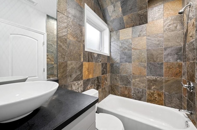 1018 N Honore Ave Unit C, Chicago, IL 60622 - bathroom with tile walls, toilet, shower / washtub combination, and vanity