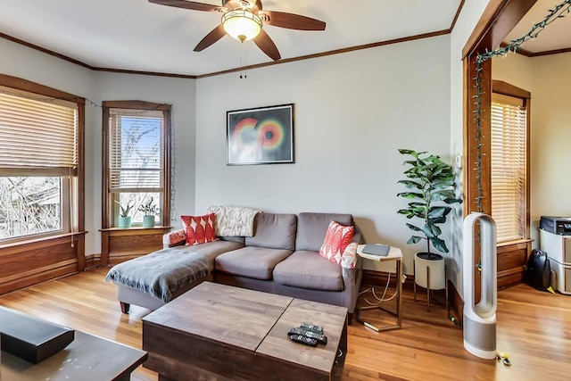 3746 N Hermitage Ave, Chicago, IL 60613 - living room with wood finished floors, crown molding, ceiling fan, and baseboards