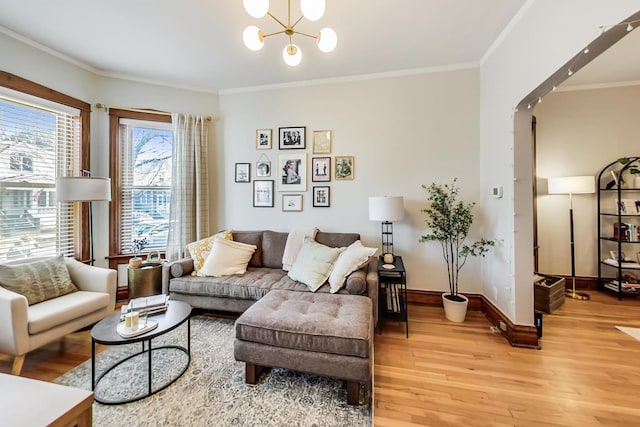 3746 N Hermitage Ave, Chicago, IL 60613 - living area featuring light wood-style floors, ornamental molding, a chandelier, and baseboards