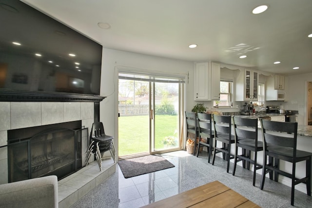 5025 Jerome Ave, Skokie, IL 60077 - living area with granite tiled floors, recessed lighting, and a fireplace