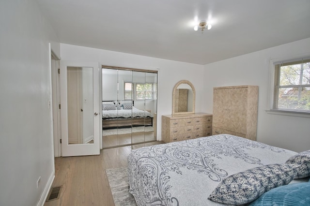 5025 Jerome Ave, Skokie, IL 60077 - bedroom featuring wood finished floors, a closet, and baseboards