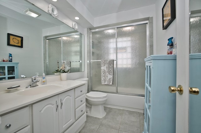 5025 Jerome Ave, Skokie, IL 60077 - bathroom with tile patterned floors, toilet, vanity, and combined bath / shower with glass door