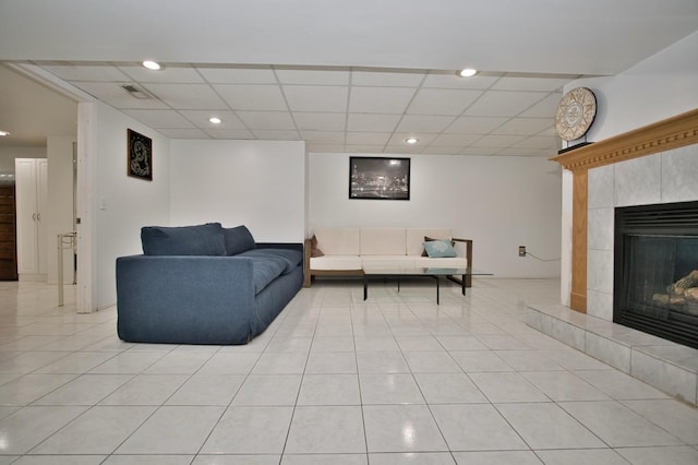 5025 Jerome Ave, Skokie, IL 60077 - living room with light tile patterned flooring, a drop ceiling, a tile fireplace, and recessed lighting