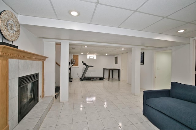 5025 Jerome Ave, Skokie, IL 60077 - living area featuring a drop ceiling, light tile patterned flooring, a tiled fireplace, and recessed lighting
