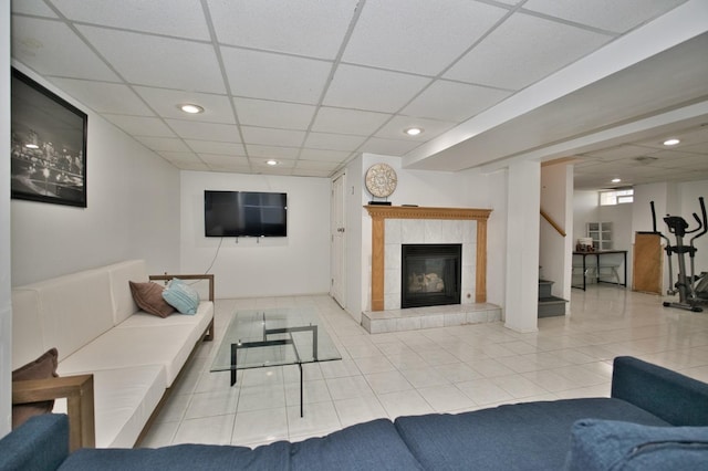 5025 Jerome Ave, Skokie, IL 60077 - tiled living room with a paneled ceiling, stairs, recessed lighting, and a tiled fireplace