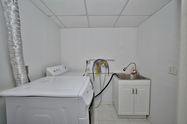 5025 Jerome Ave, Skokie, IL 60077 - clothes washing area featuring cabinet space, light tile patterned flooring, separate washer and dryer, and baseboards