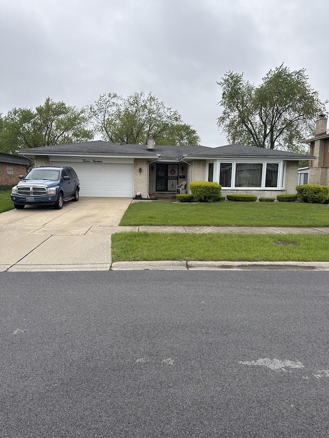 1214 E 165th St, South Holland, IL 60473 - view of front of house with a garage, driveway, a front yard, a chimney, and brick siding