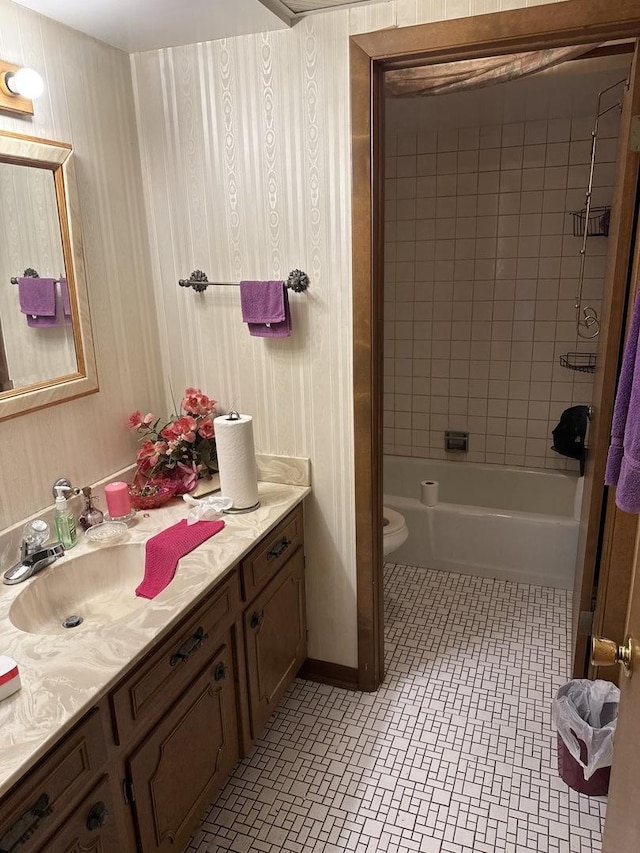 1214 E 165th St, South Holland, IL 60473 - bathroom featuring tile patterned floors, toilet, vanity, baseboards, and shower / bath combination