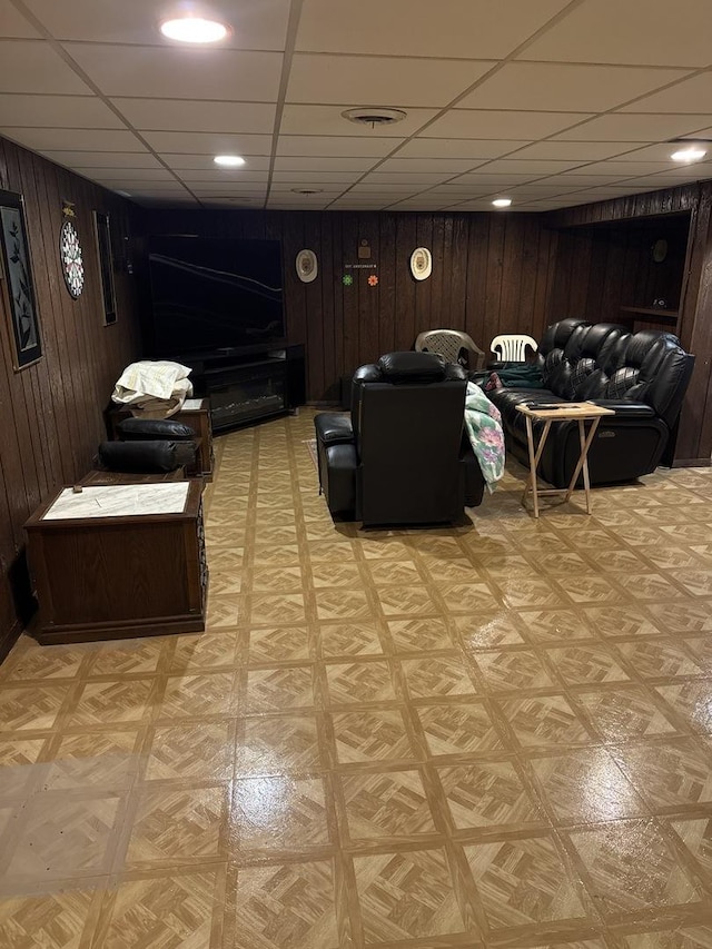 1214 E 165th St, South Holland, IL 60473 - living area with wooden walls, a paneled ceiling, and light flooring