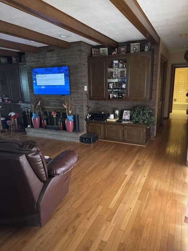 1214 E 165th St, South Holland, IL 60473 - living area with light wood-style floors and beam ceiling