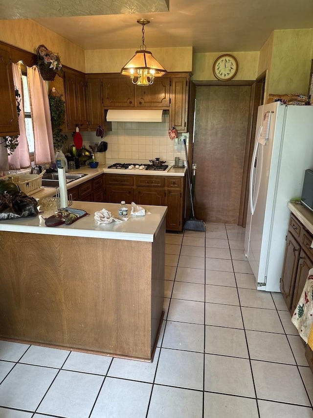 1214 E 165th St, South Holland, IL 60473 - kitchen with under cabinet range hood, white appliances, light countertops, and light tile patterned flooring