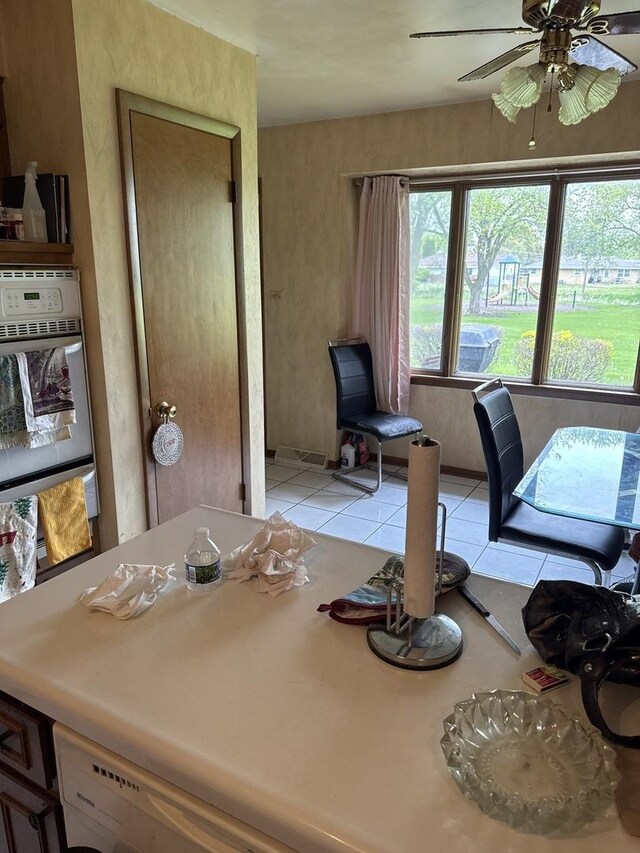 1214 E 165th St, South Holland, IL 60473 - dining space with a ceiling fan and light tile patterned floors