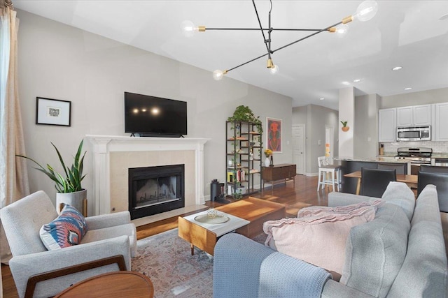 3616 N Janssen Ave Unit 2N, Chicago, IL 60613 - living area with wood finished floors, recessed lighting, a tile fireplace, and baseboards