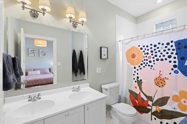 3616 N Janssen Ave Unit 2N, Chicago, IL 60613 - ensuite bathroom featuring double vanity, toilet, and a shower with curtain