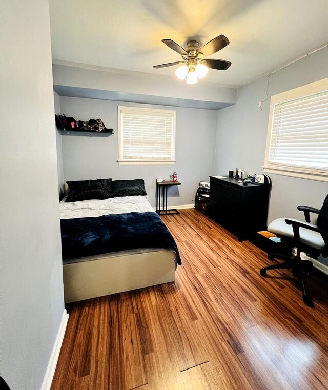 8605 Leclaire Ave, Burbank, IL 60459 - bedroom featuring wood finished floors, baseboards, and ceiling fan