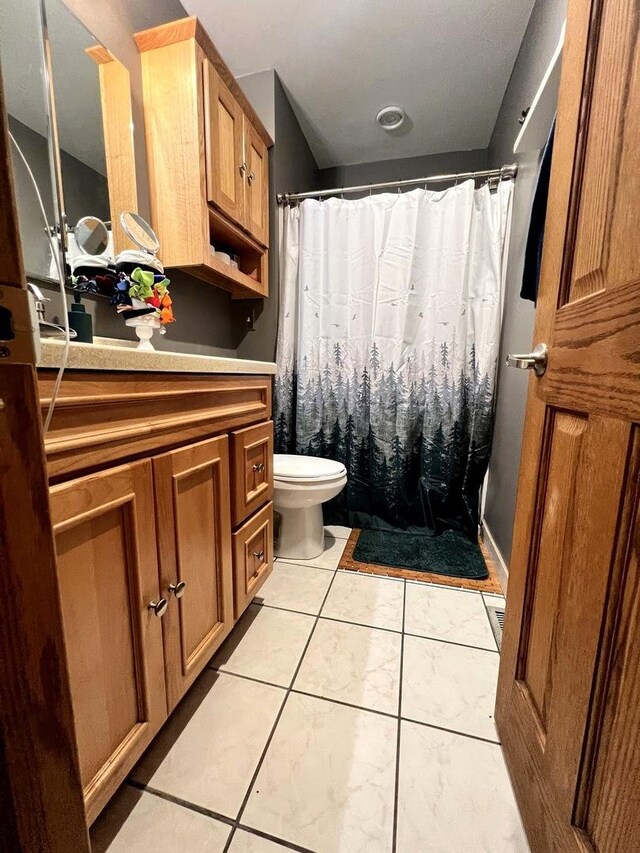 8605 Leclaire Ave, Burbank, IL 60459 - bathroom with vanity, toilet, and a shower with shower curtain