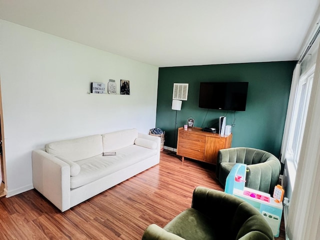 8605 Leclaire Ave, Burbank, IL 60459 - living area featuring wood finished floors, baseboards, and an accent wall