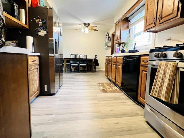 8605 Leclaire Ave, Burbank, IL 60459 - kitchen featuring stainless steel appliances, light wood-style floors, ceiling fan, and brown cabinetry