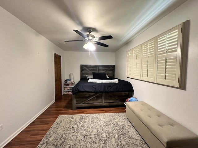 8605 Leclaire Ave, Burbank, IL 60459 - bedroom with dark wood-style floors, baseboards, and ceiling fan