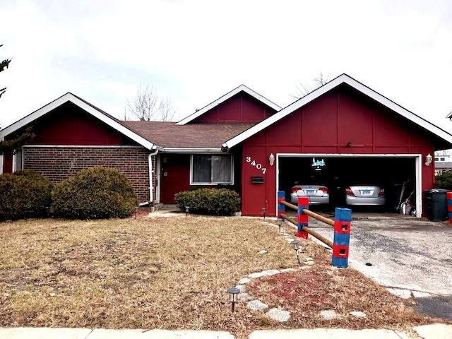 single story home with a garage, driveway, roof with shingles, and brick siding