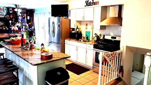 3407 Fountainbleau Dr, Hazel Crest, IL 60429 - kitchen with wall chimney exhaust hood, appliances with stainless steel finishes, a sink, and white cabinetry